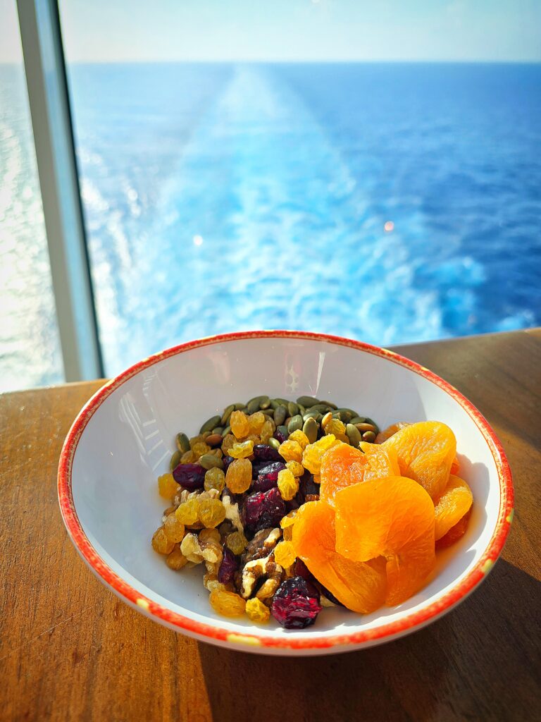 bowl of raisins, dried fruit, and seeds