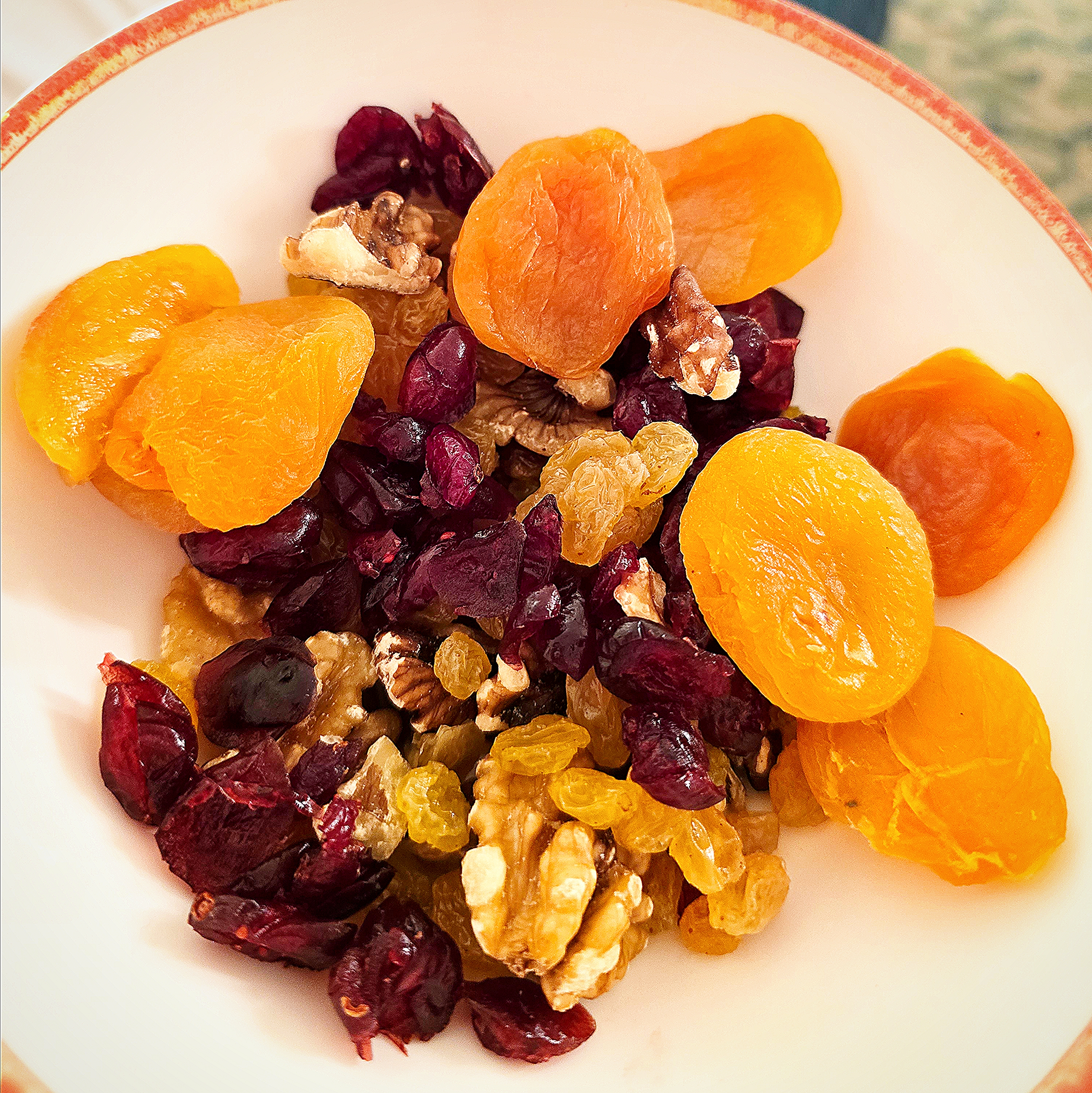 snack of dried fruit, walnuts, and raisins