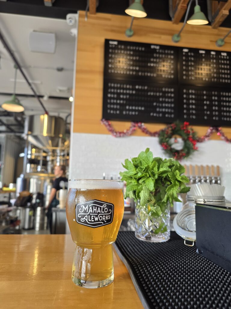 pint of beer with flip board display in the background